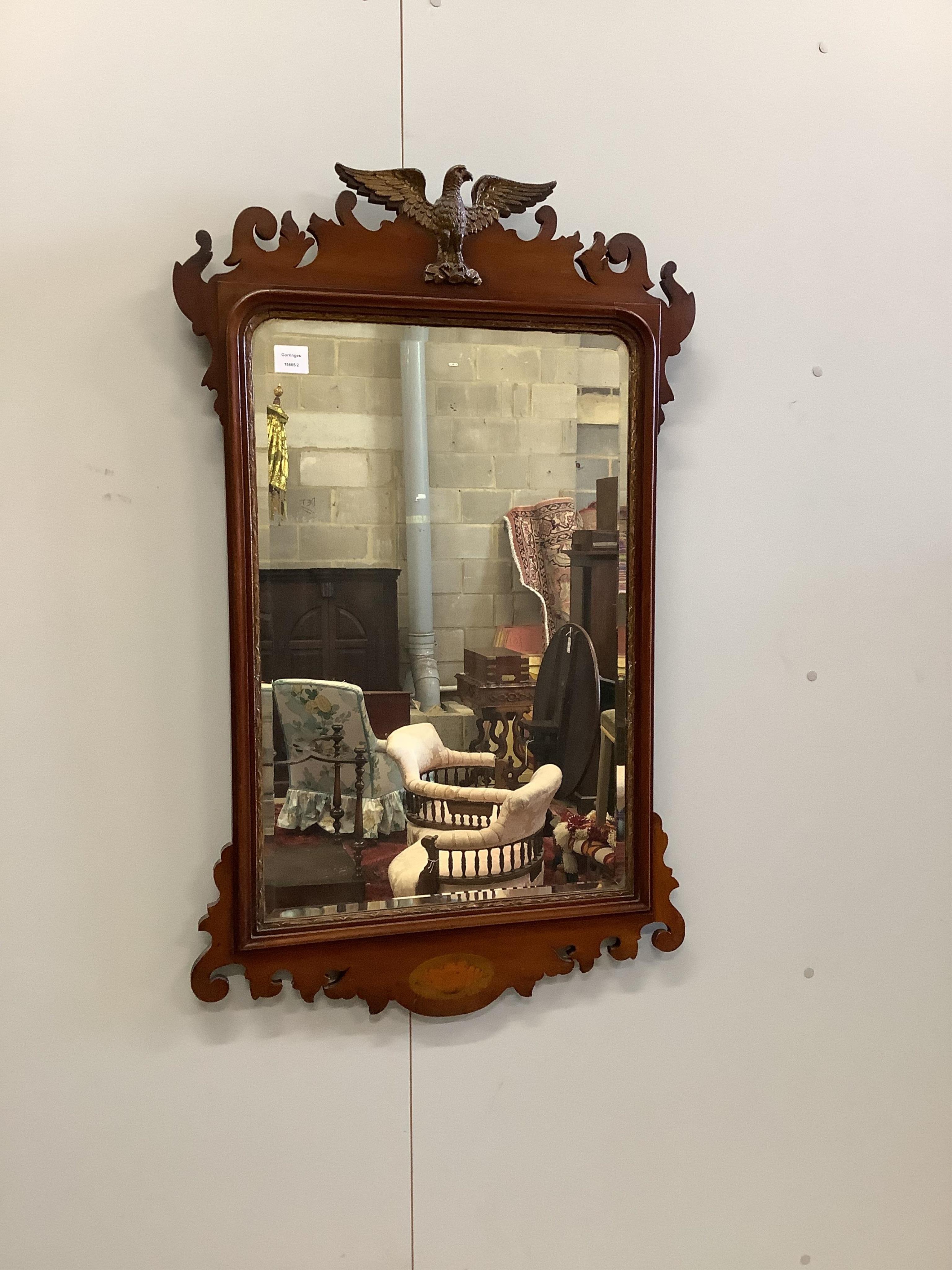 A Georgian style mahogany fret frame wall mirror with eagle crest, width 68cm, height 110cm. Condition - good